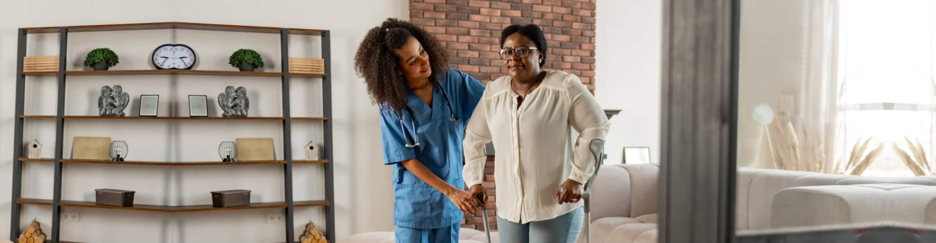 woman assist old woman in walking