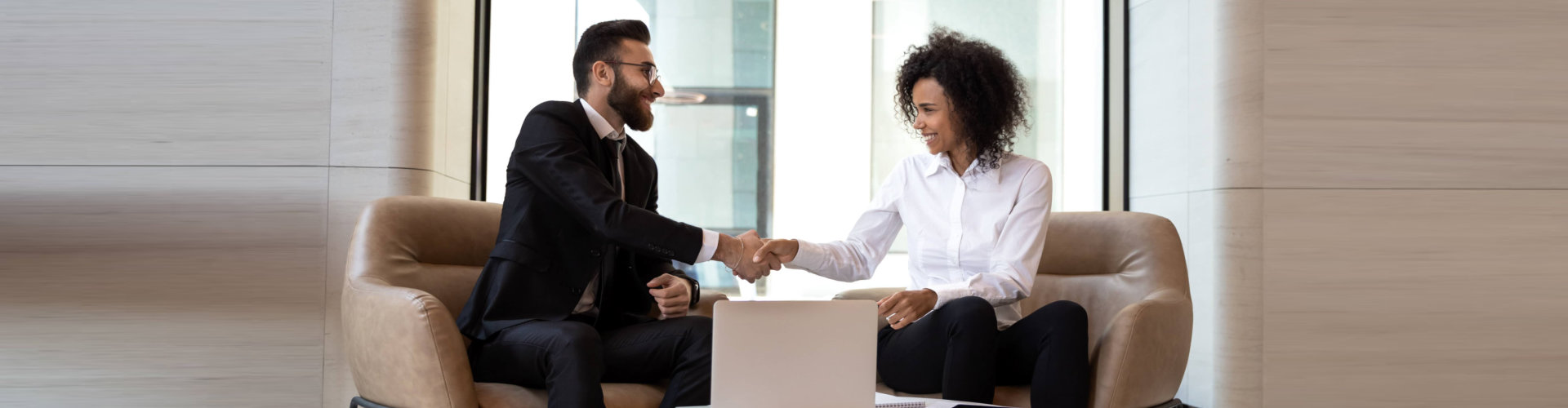 man and woman shake hands